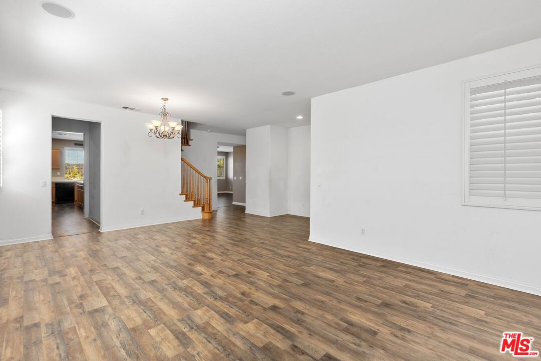 1061 Boulder Place Oceanside, CA 92057 - Photo 9 of 19 a view of empty room with wooden floor