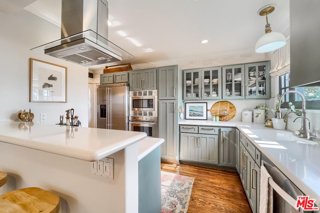 920 Highline Road Glendale, CA 91205 - Photo 15 of 49 a kitchen with stainless steel appliances a sink stove and refrigerator