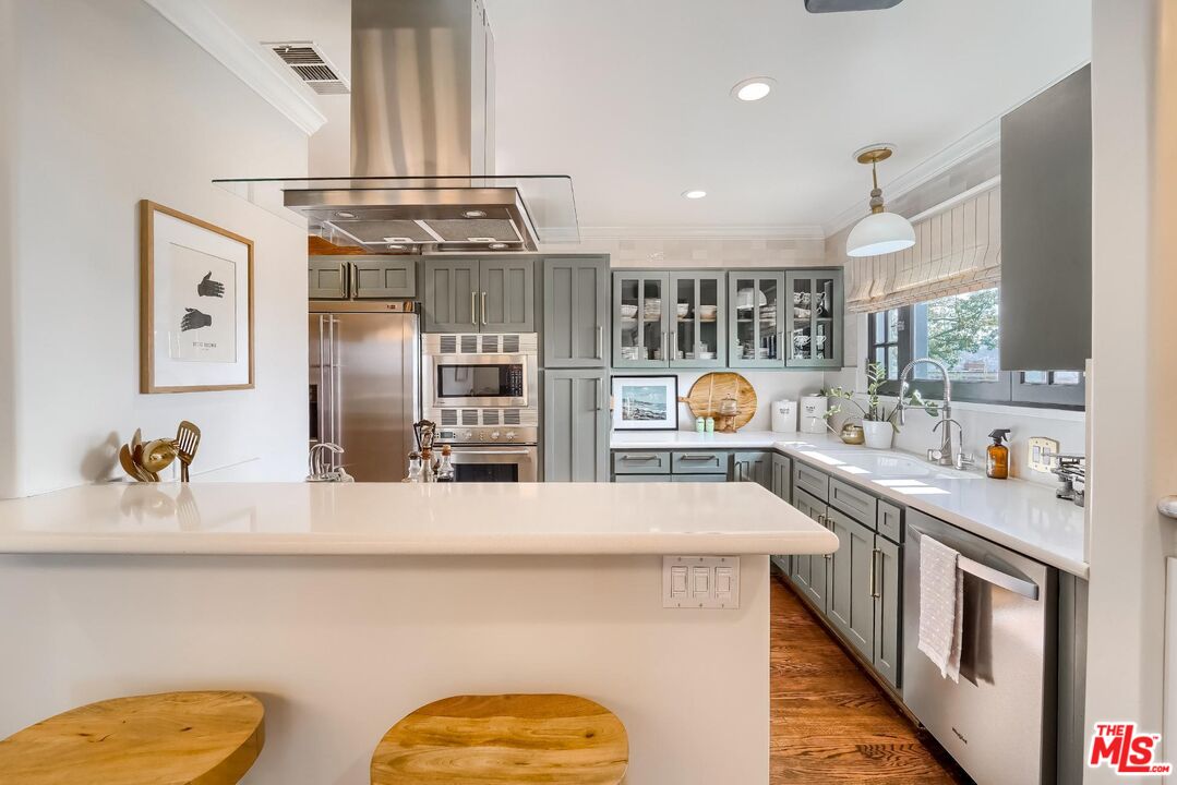 920 Highline Road Glendale, CA 91205 - Photo 16 of 49 a kitchen with stainless steel appliances a sink and a stove