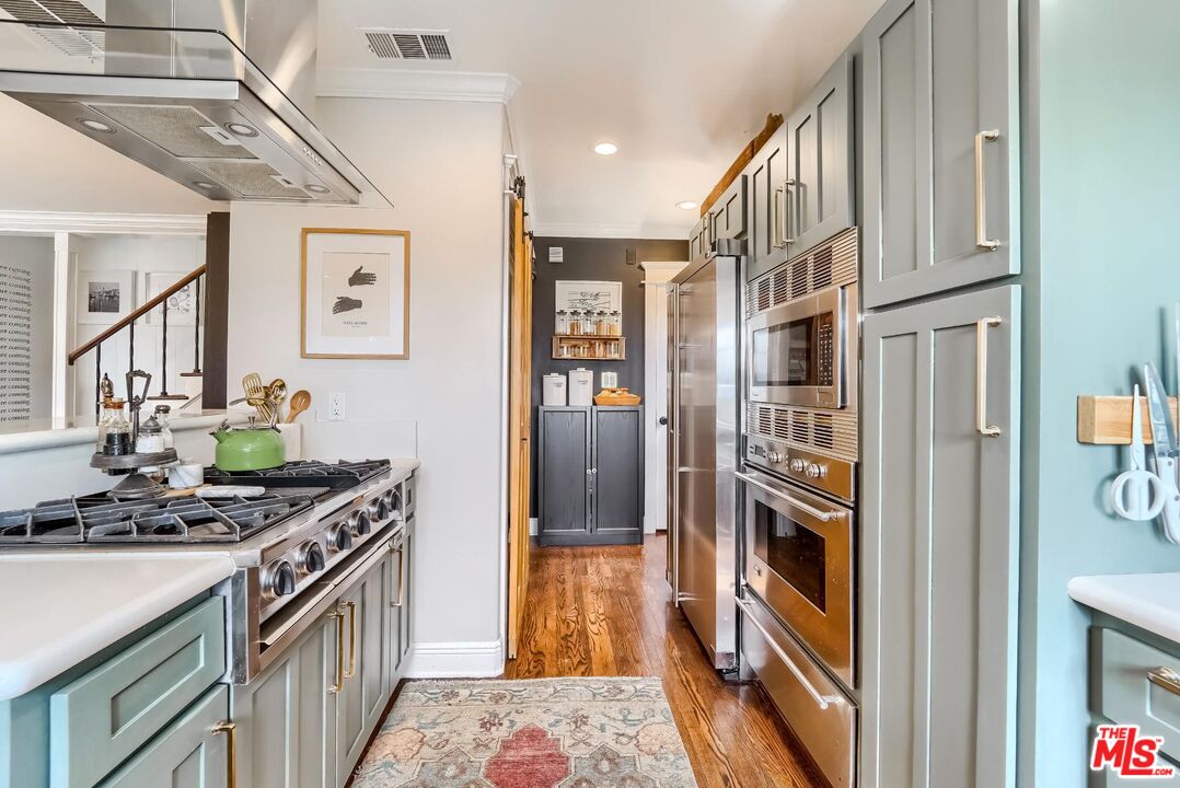 920 Highline Road Glendale, CA 91205 - Photo 18 of 49 a kitchen with stainless steel appliances granite countertop a refrigerator and a stove
