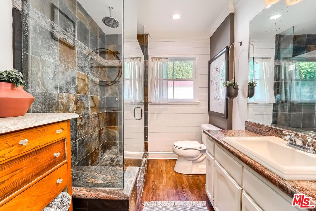 920 Highline Road Glendale, CA 91205 - Photo 35 of 49 a bathroom with a sink a toilet and shower