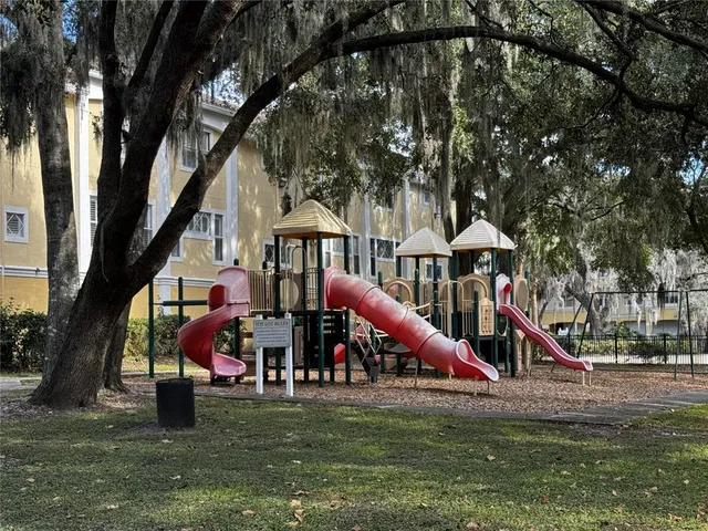 a childrens park with lots of swings and slides