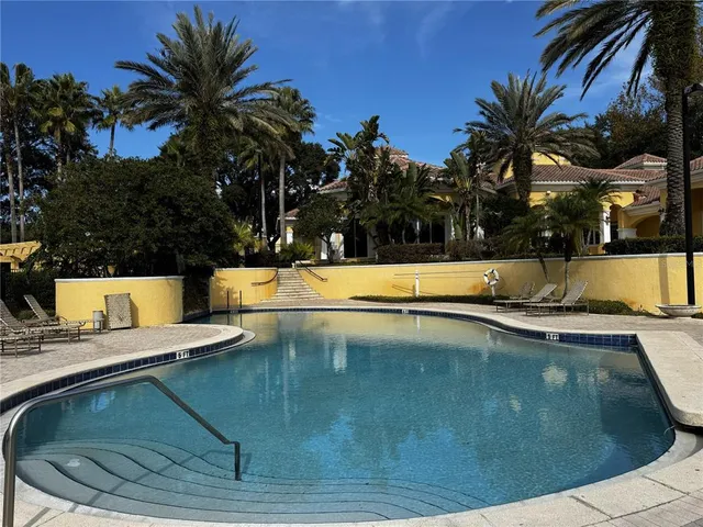 a view of a swimming pool with a patio