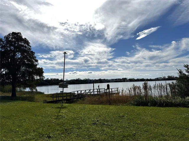 a view of a lake with a big yard