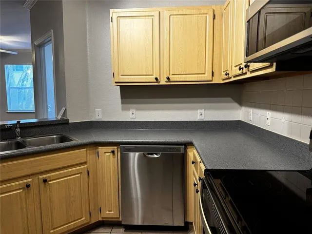 a close view of sink and cabinets