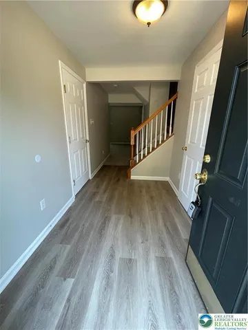 a view of entryway with wooden floor