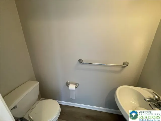 a bathroom with a toilet and a sink