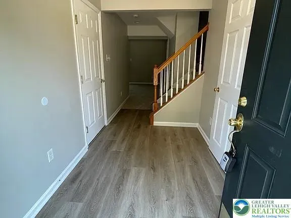 a view of entryway with wooden floor