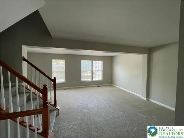 a view of an empty room with windows