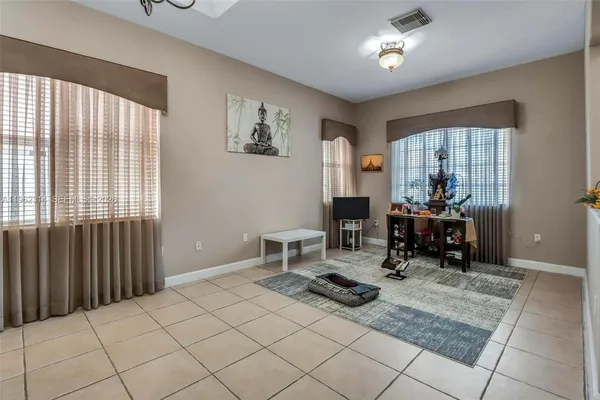 a living room with furniture and a table