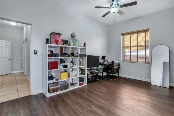 a room with furniture and a wooden floor