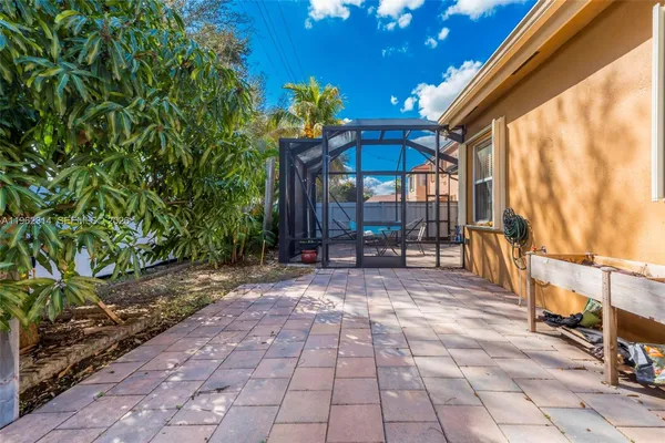 a view of a chairs and table in the patio