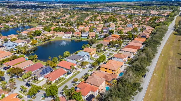 an aerial view of residential houses with outdoor space