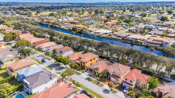 an aerial view of residential houses with outdoor space