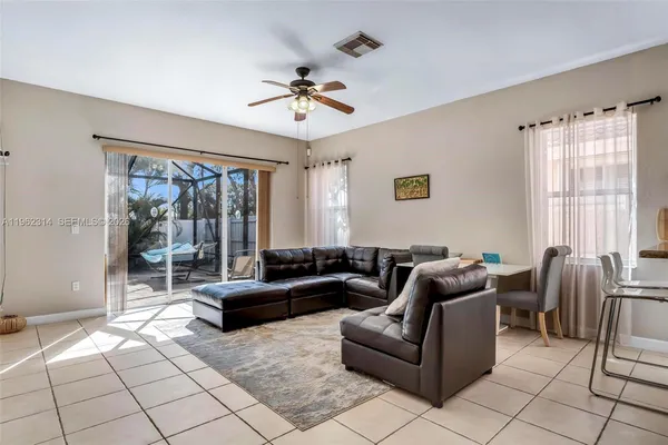 a living room with furniture and a large window
