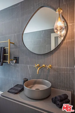 a bedroom with a bed wooden floor and window