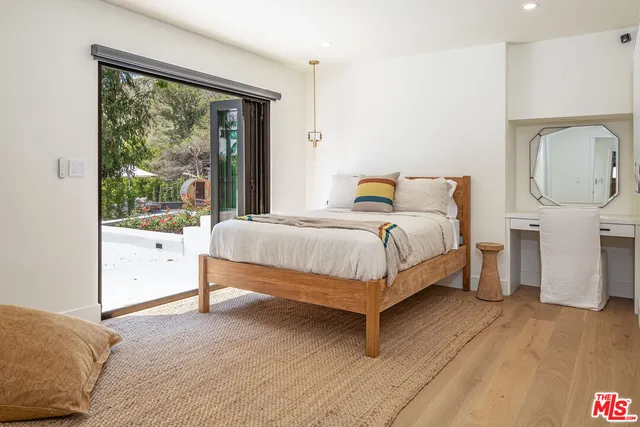 a view of room with cabinets and wooden floor