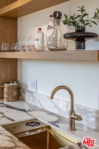 a close view of sink and cabinets