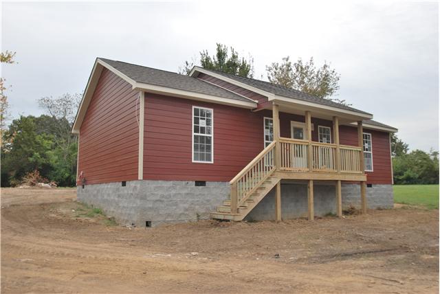 786 New Deal Potts Road Cottontown, TN 37048 - Photo 1 of 12 a front view of a house with a yard and garage