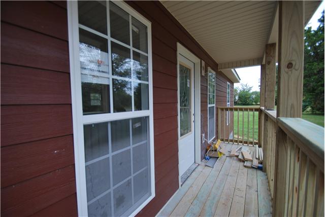 786 New Deal Potts Road Cottontown, TN 37048 - Photo 12 of 12 a view of balcony with wooden floor and fence