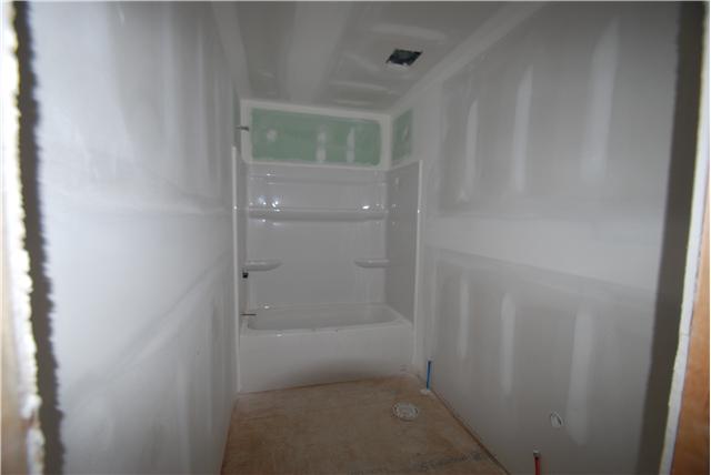 786 New Deal Potts Road Cottontown, TN 37048 - Photo 8 of 12 a bathroom with a glass shower door