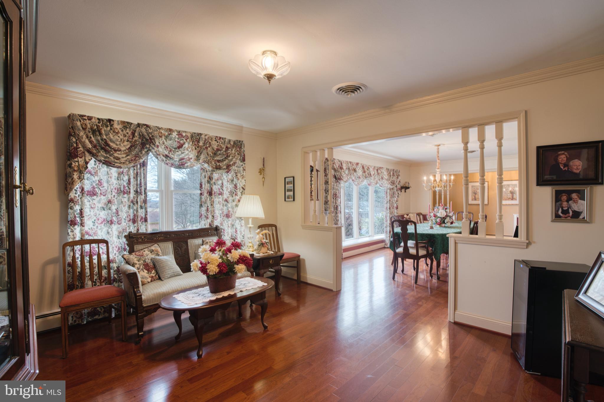 2026 Fallsgrove Way Fallston, MD 21047 - Photo 15 of 62 a living room with furniture a dining table and a large window