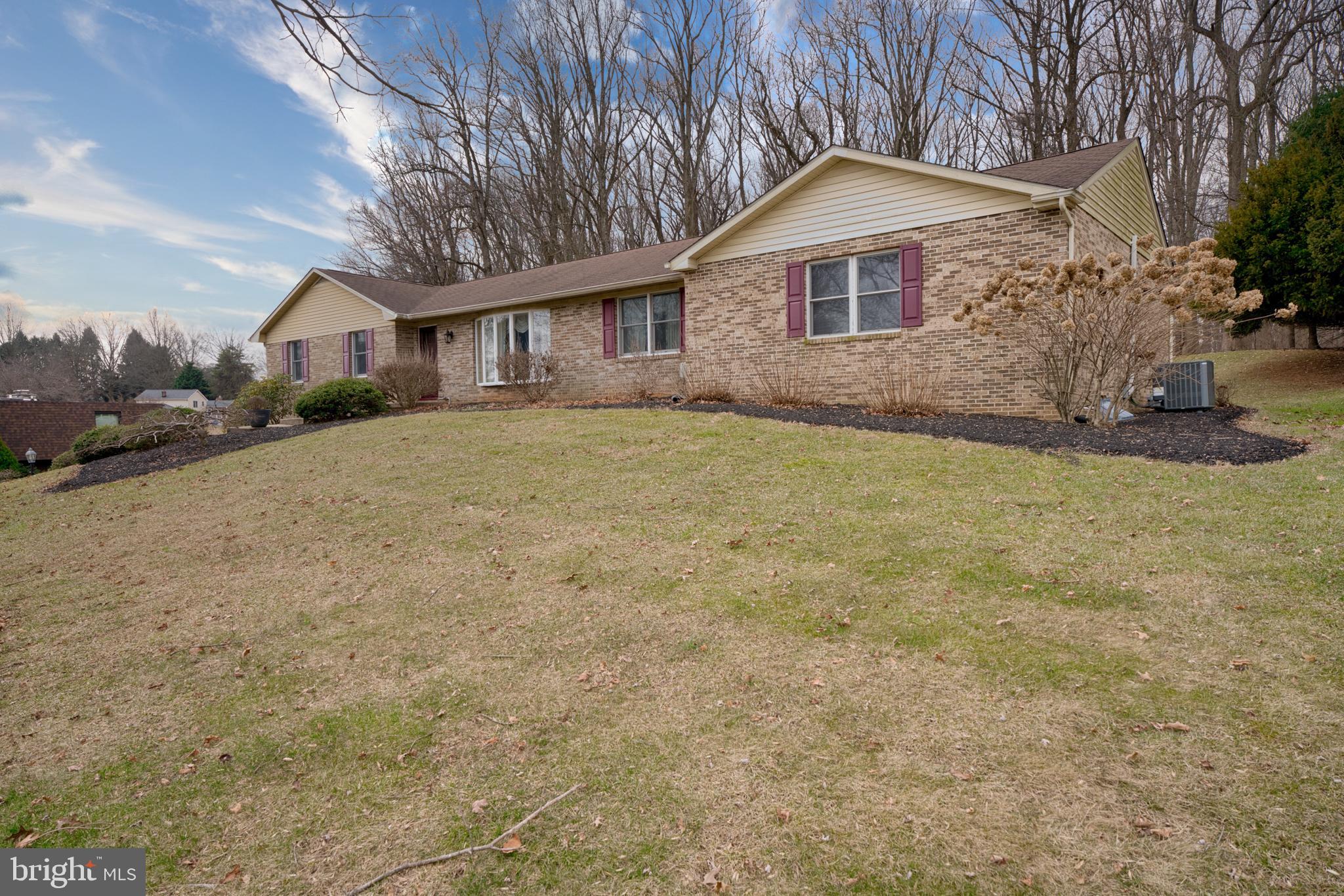 2026 Fallsgrove Way Fallston, MD 21047 - Photo 2 of 62 a front view of a house with a yard and garage