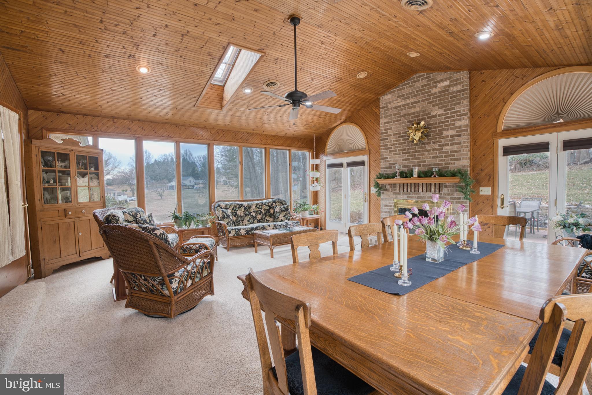 2026 Fallsgrove Way Fallston, MD 21047 - Photo 22 of 62 a dining room with furniture a chandelier and wooden floor