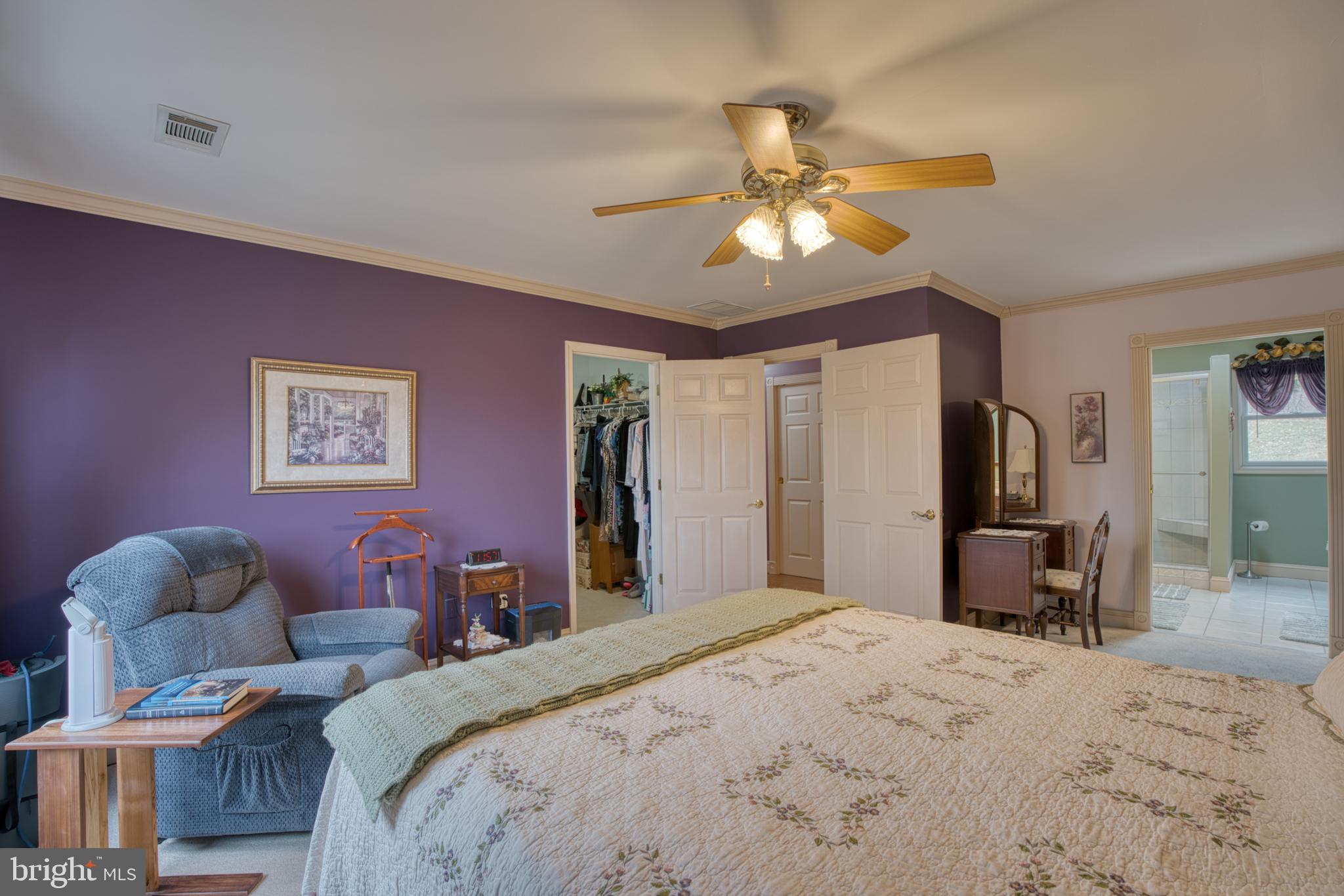 2026 Fallsgrove Way Fallston, MD 21047 - Photo 35 of 62 a bedroom with a bed and a chandelier
