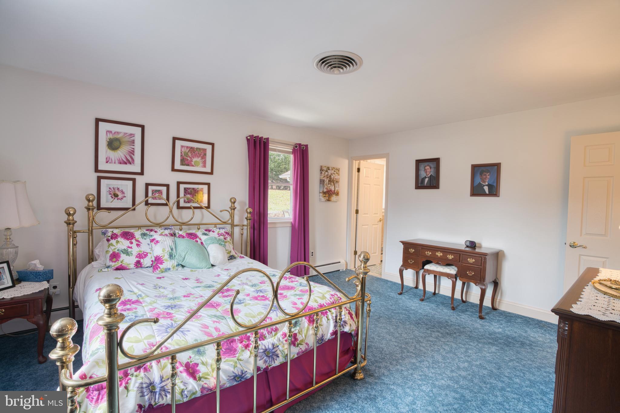 2026 Fallsgrove Way Fallston, MD 21047 - Photo 46 of 62 a bedroom with bed and paintings on the wall