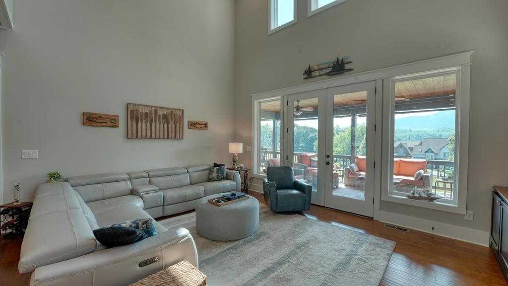31 Elf School Road Hayesville, NC 28904 - Photo 24 of 59 a living room with furniture and a floor to ceiling window