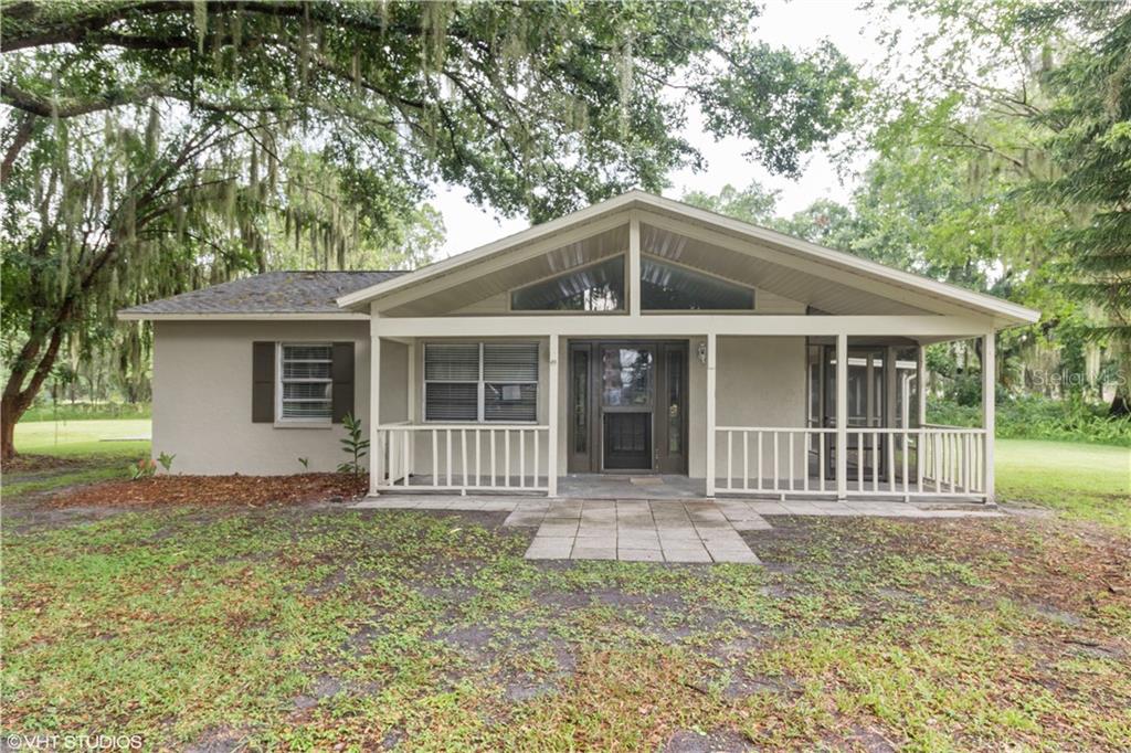 10011 Harris Ranch Road Lithia, FL 33547 - Photo 1 of 1 a front view of a house with garden