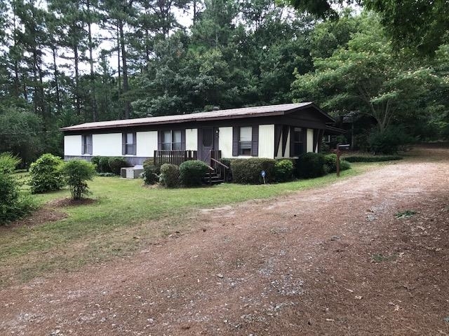 194 Giles Road Winder, GA 30680 - Photo 1 of 1 a front view of a house with a yard and trees