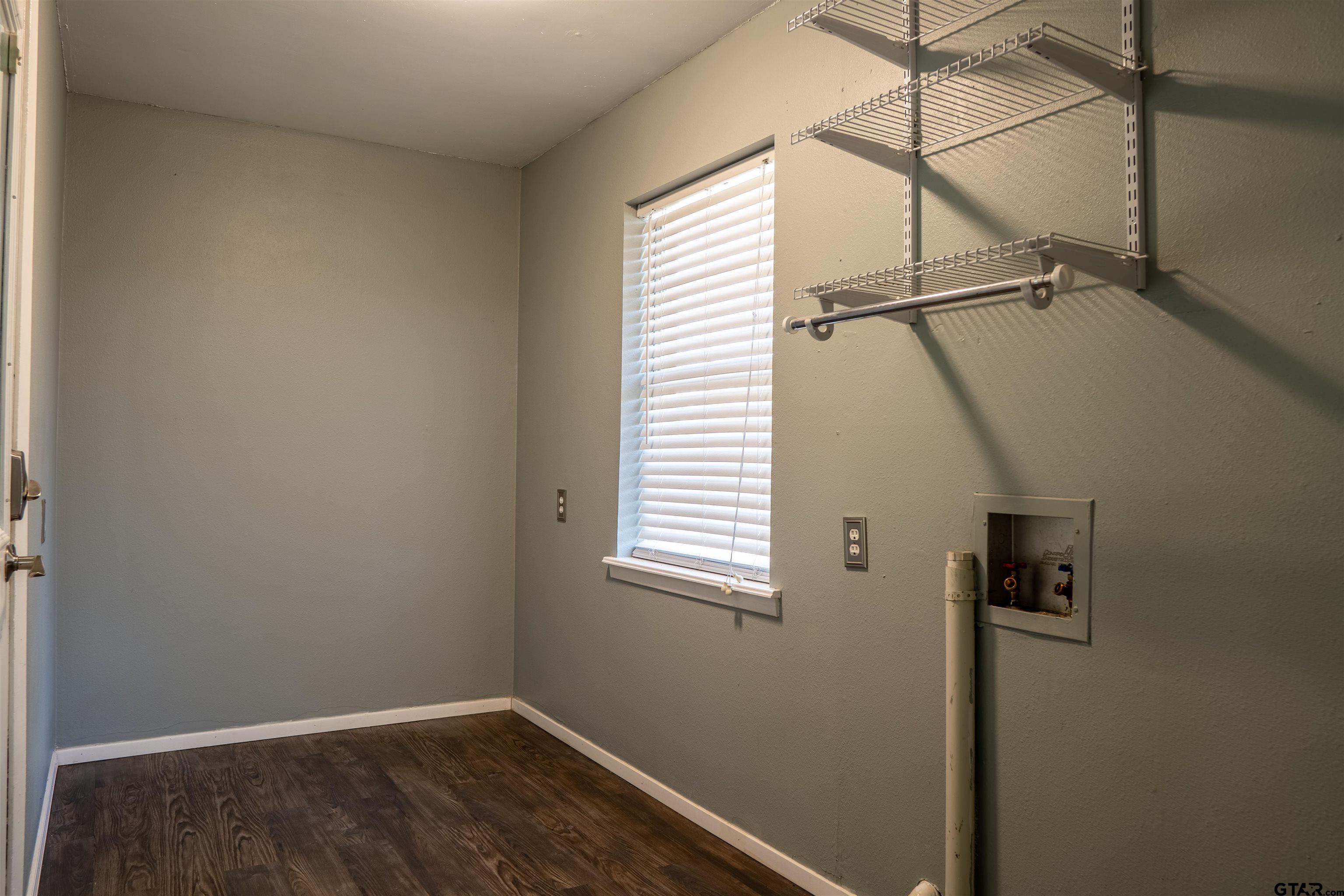 4006 Mark Lane Mount Pleasant, TX 75455 - Photo 14 of 28 a view of a small space with wooden floor and a window