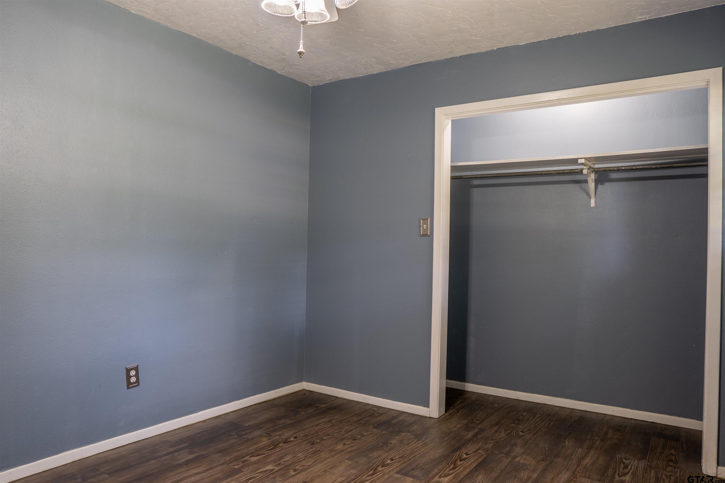 4006 Mark Lane Mount Pleasant, TX 75455 - Photo 18 of 28 wooden floor in an empty room