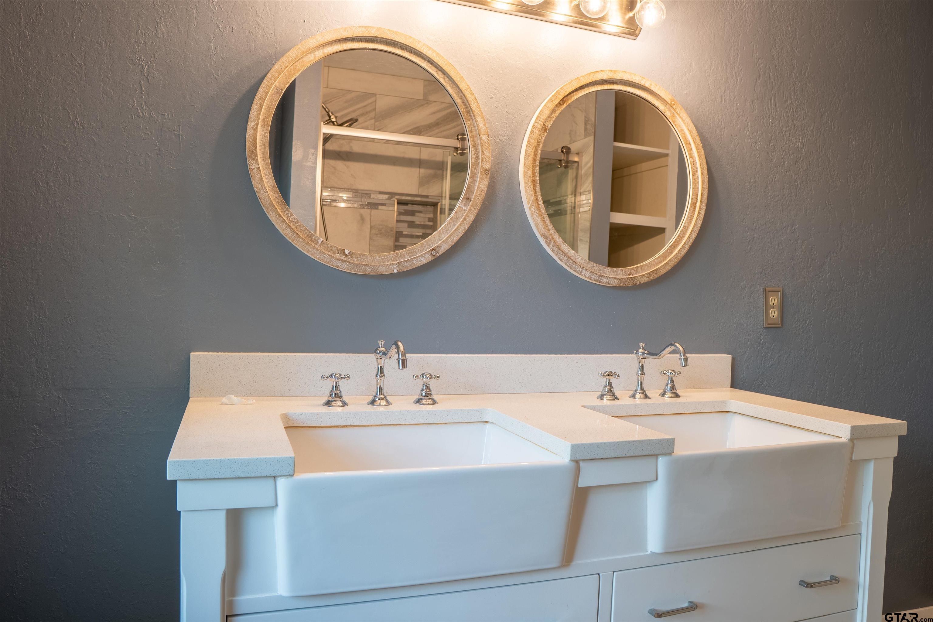 4006 Mark Lane Mount Pleasant, TX 75455 - Photo 23 of 28 a bathroom with a sink and a mirror
