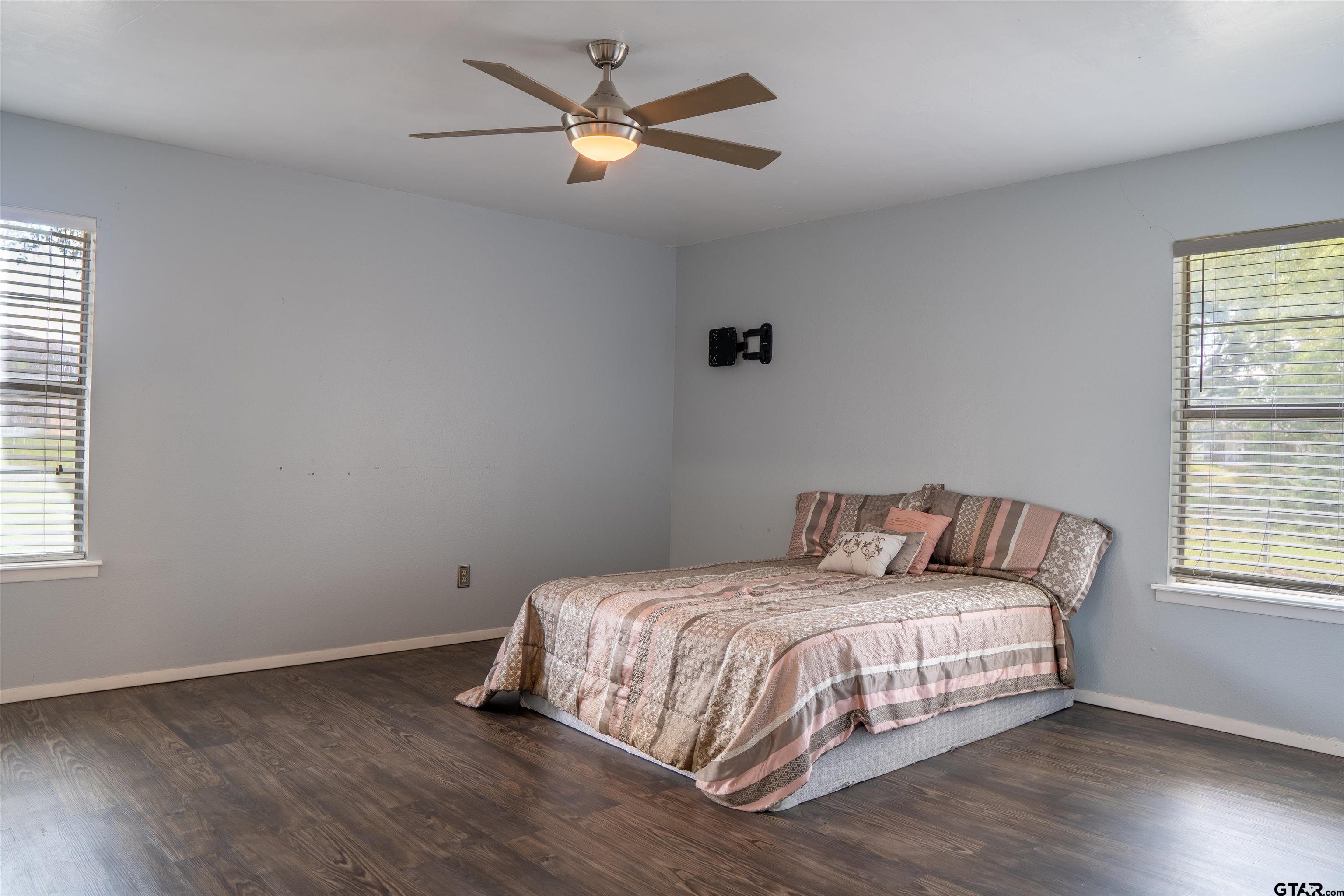 4006 Mark Lane Mount Pleasant, TX 75455 - Photo 27 of 28 a bedroom with a bed and a window