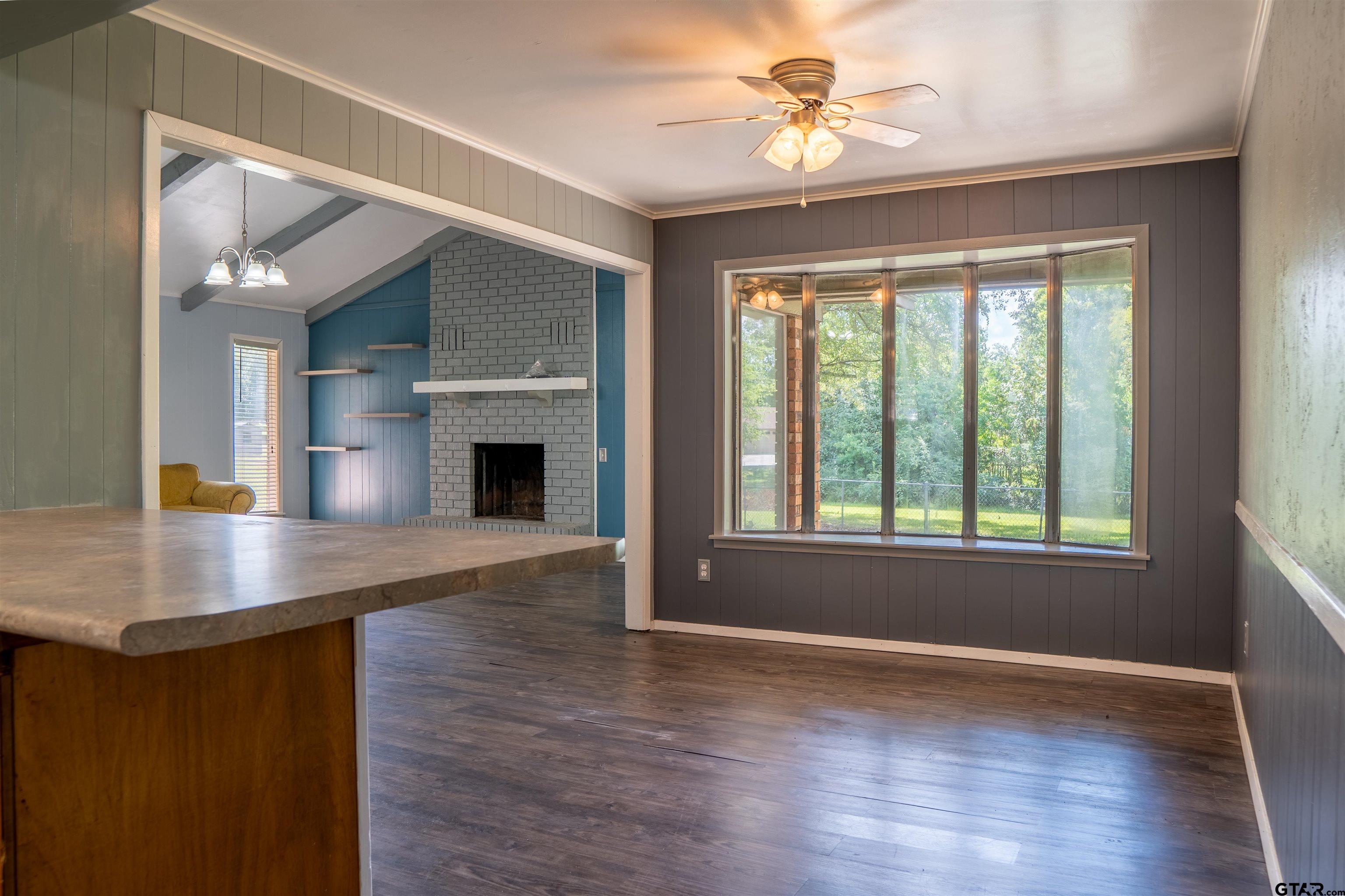 4006 Mark Lane Mount Pleasant, TX 75455 - Photo 3 of 28 a view of an empty room with window and wooden floor