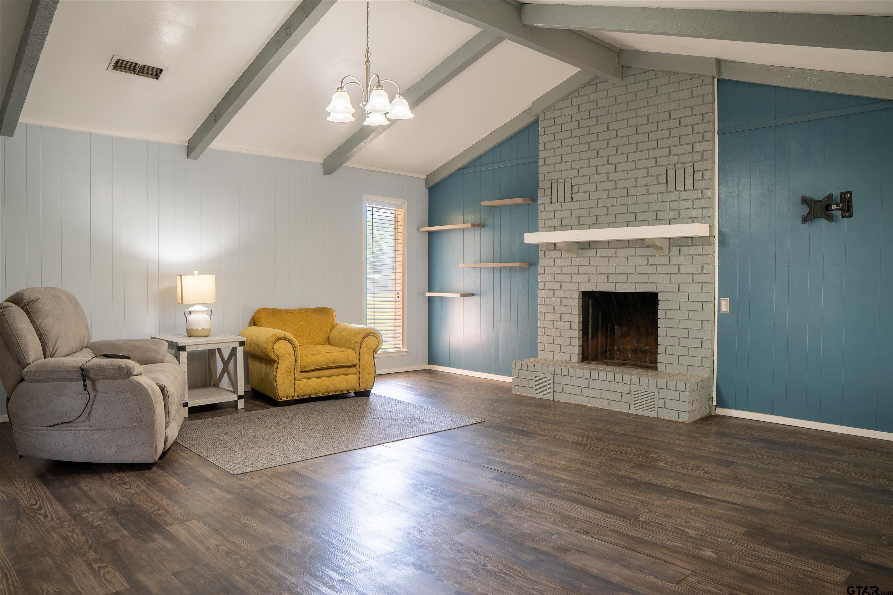 4006 Mark Lane Mount Pleasant, TX 75455 - Photo 5 of 28 a living room with furniture and a fireplace
