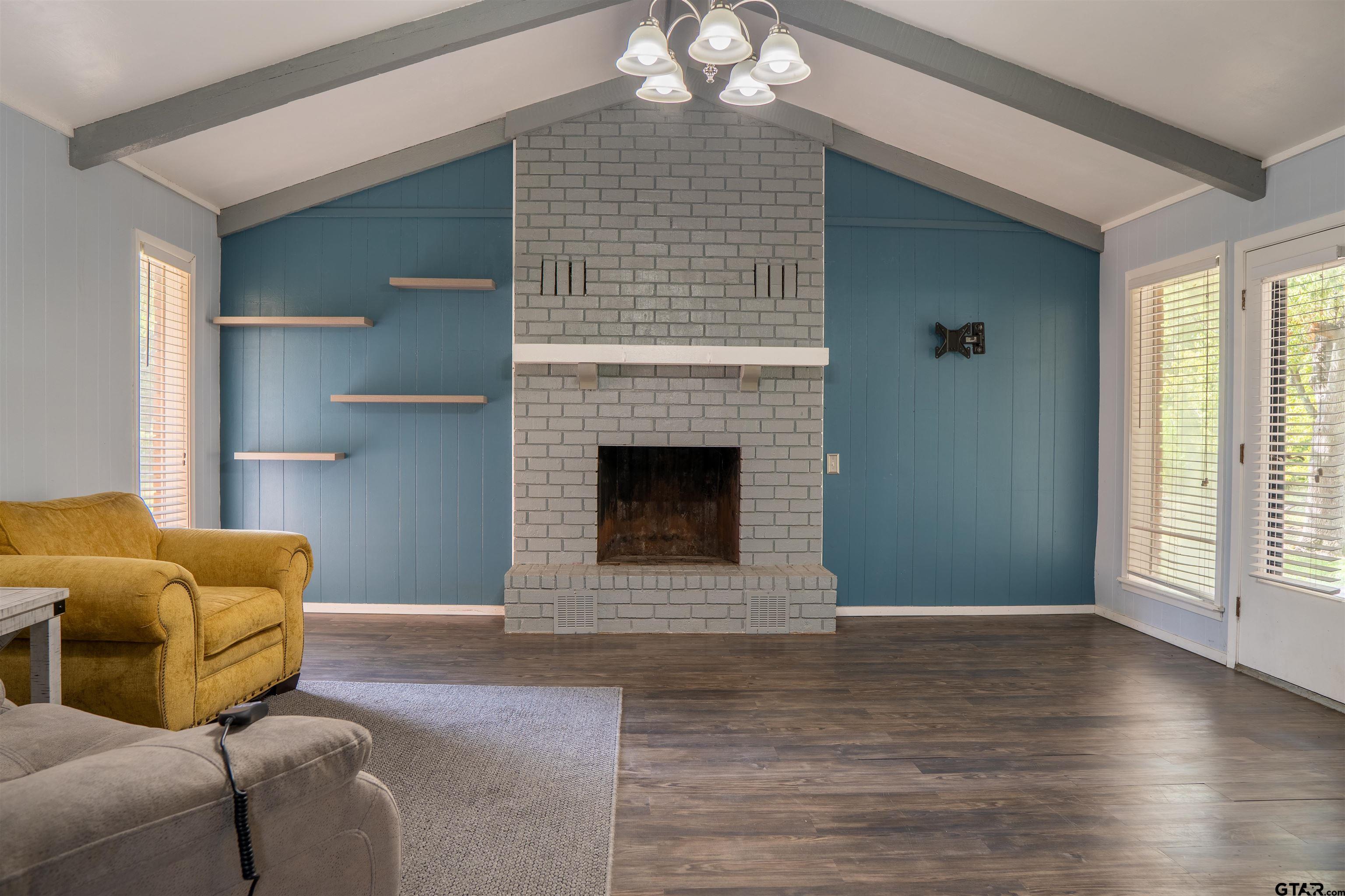 4006 Mark Lane Mount Pleasant, TX 75455 - Photo 6 of 28 a living room with furniture and a fireplace