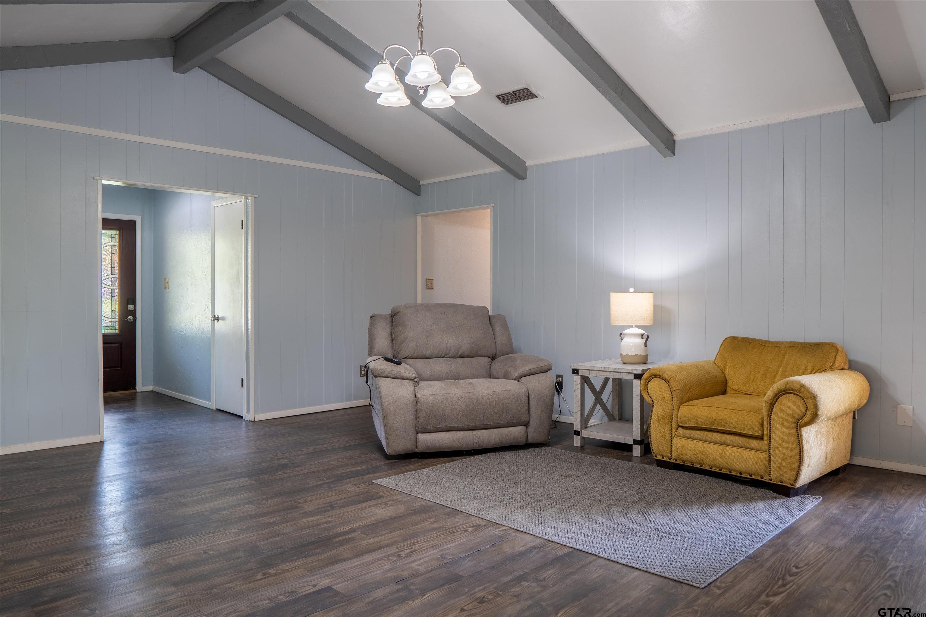 4006 Mark Lane Mount Pleasant, TX 75455 - Photo 9 of 28 a living room with furniture and a chandelier