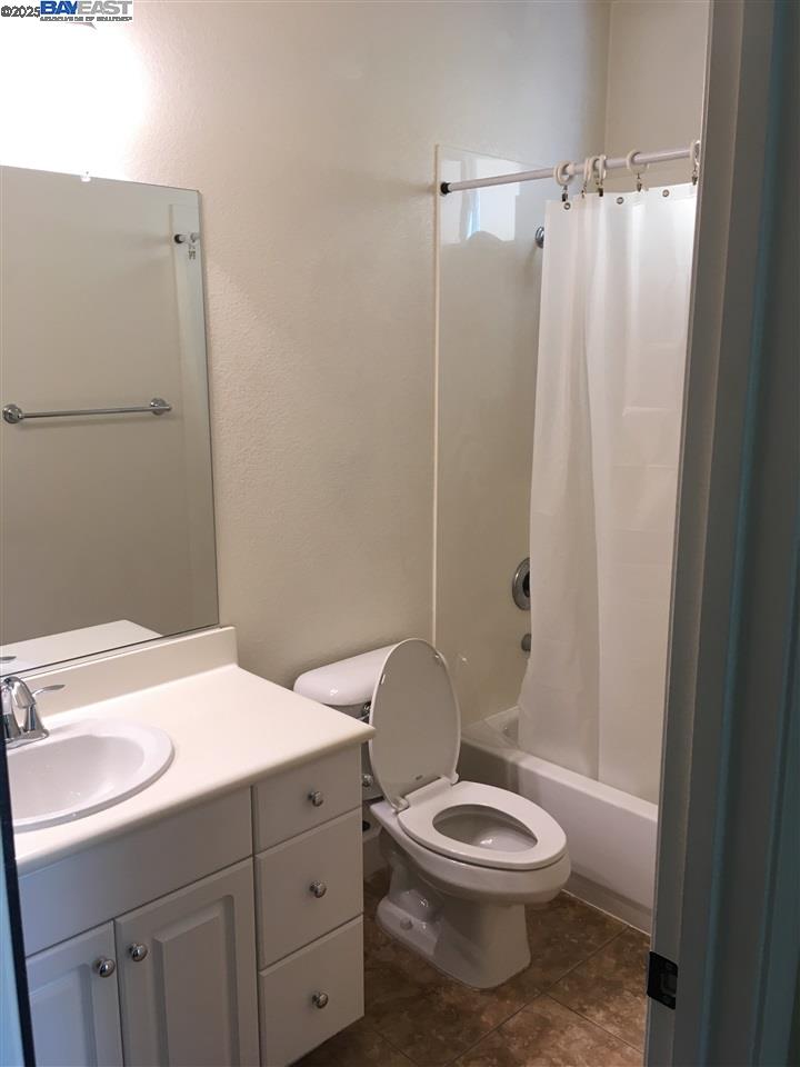 2846 Mint Common Livermore, CA 94551 - Photo 12 of 17 a bathroom with a toilet a sink and shower