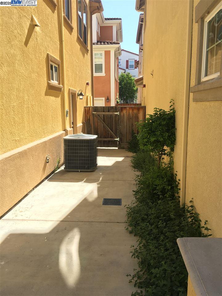 2846 Mint Common Livermore, CA 94551 - Photo 3 of 17 a view of a street with trees in front of it