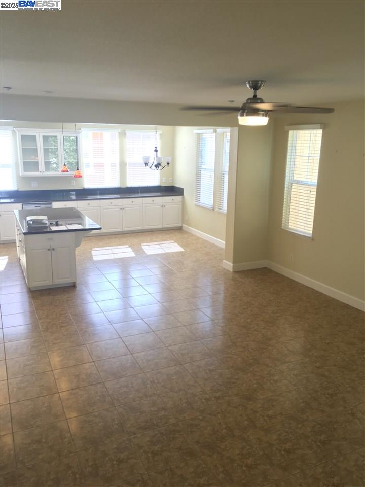 2846 Mint Common Livermore, CA 94551 - Photo 6 of 17 a large kitchen with lot of cabinets and a wooden floor