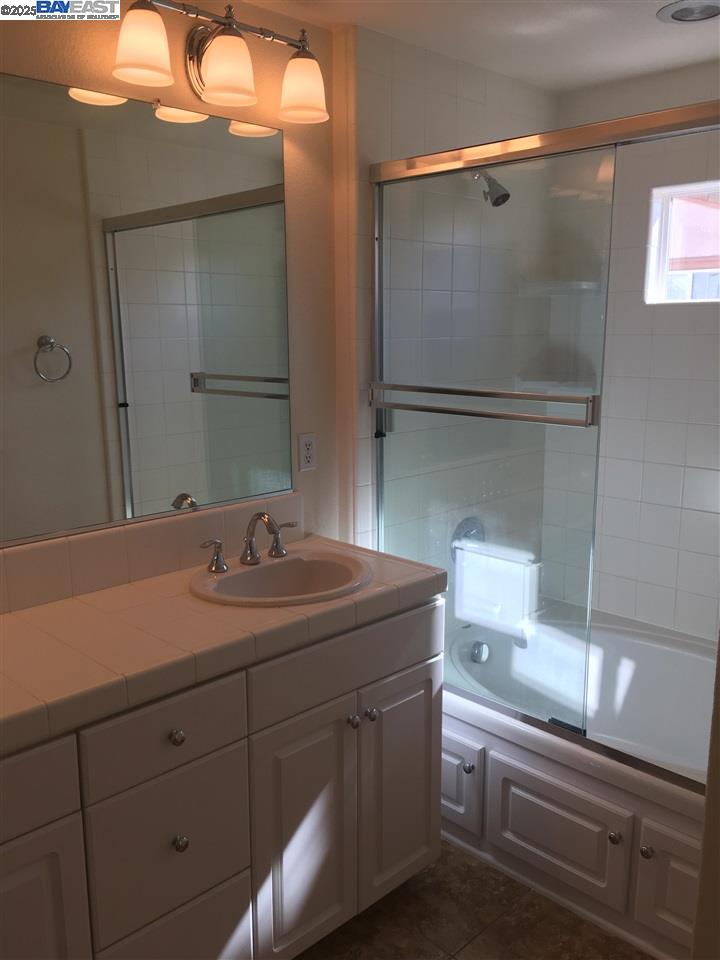 2846 Mint Common Livermore, CA 94551 - Photo 8 of 17 a bathroom with a sink a toilet and mirror