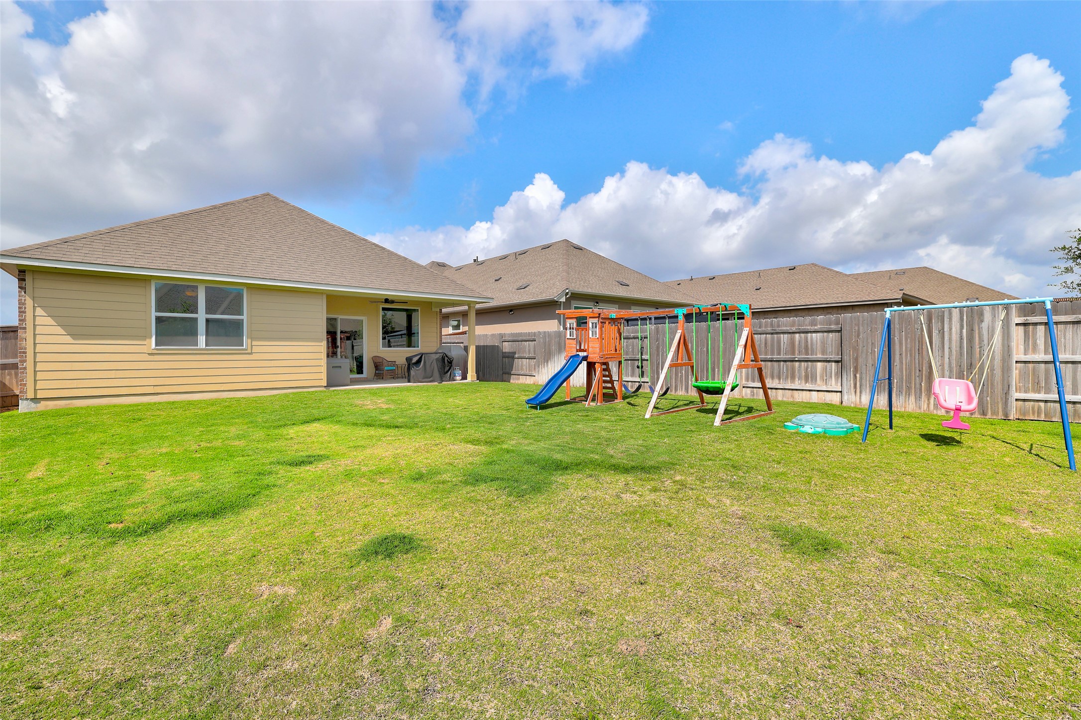 112 Rocking R Court Georgetown, TX 78633 - Photo 35 of 40 A spacious backyard with vibrant green grass, perfect for outdoor activities.