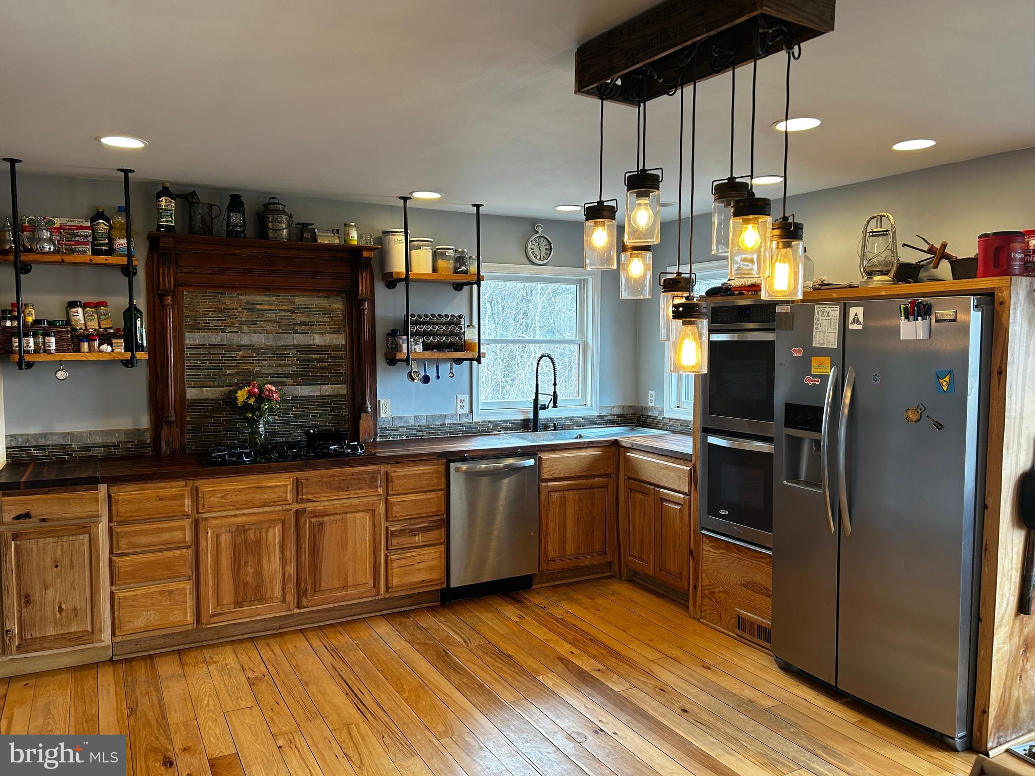 436 Hinsons Ford Road Amissville, VA 20106 - Photo 26 of 54 a kitchen with stainless steel appliances granite countertop a refrigerator and a sink
