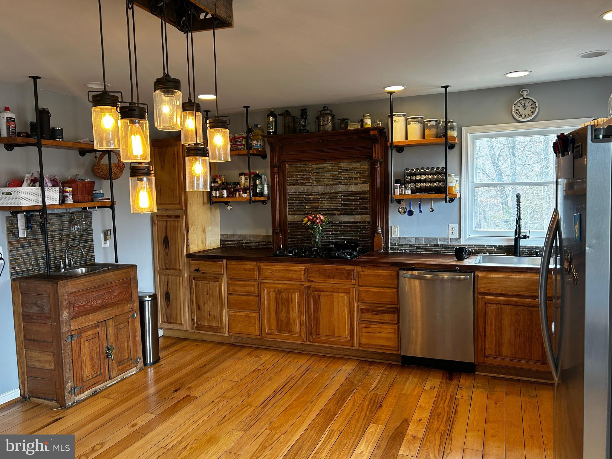 436 Hinsons Ford Road Amissville, VA 20106 - Photo 27 of 54 a kitchen with stainless steel appliances granite countertop a refrigerator a sink and a stove