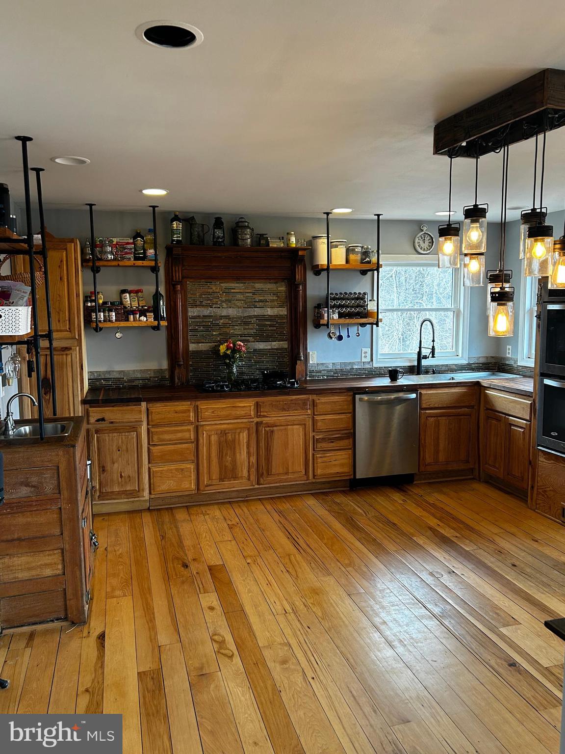 436 Hinsons Ford Road Amissville, VA 20106 - Photo 31 of 54 a kitchen with stainless steel appliances granite countertop a sink and cabinets