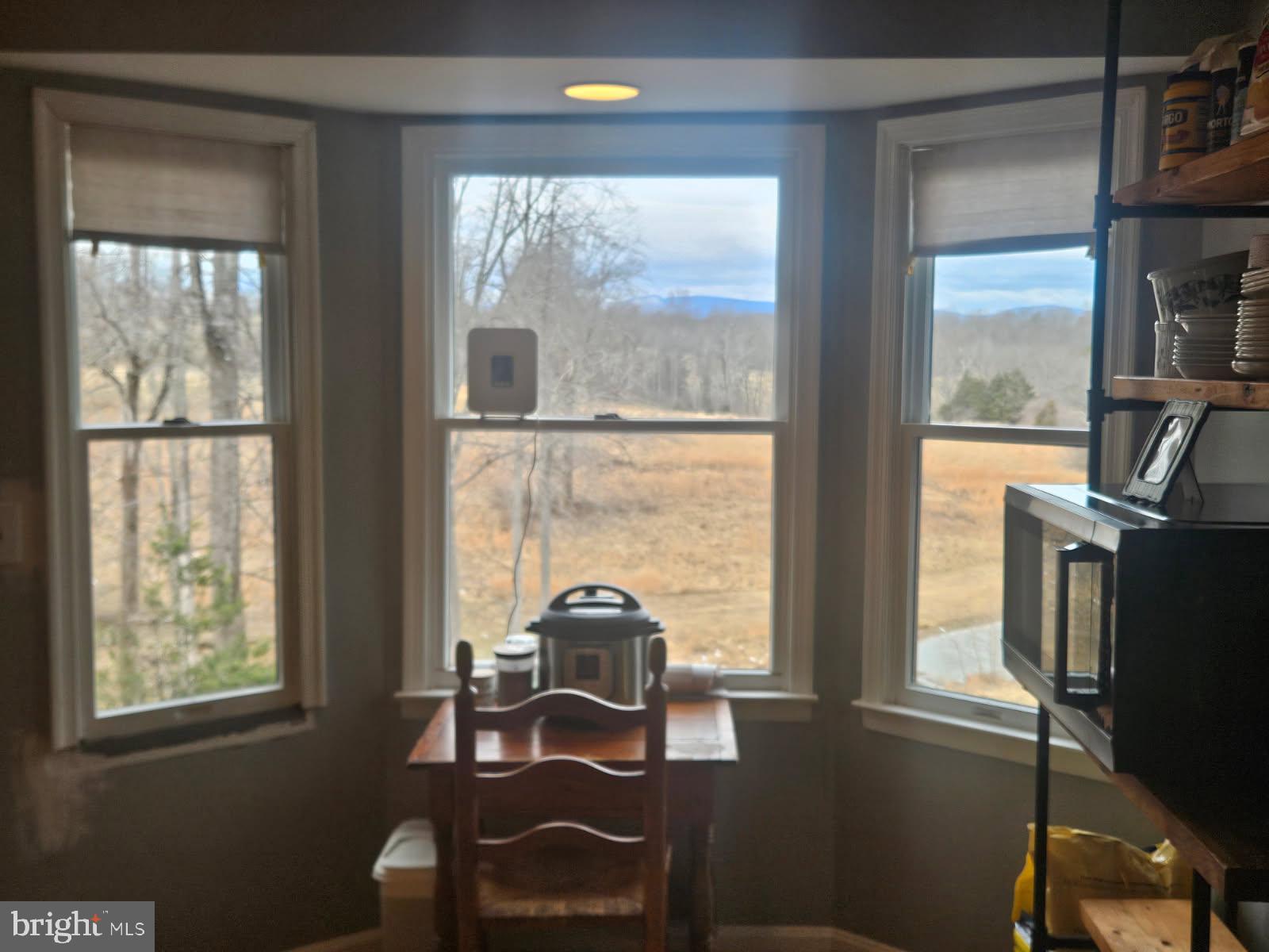 436 Hinsons Ford Road Amissville, VA 20106 - Photo 32 of 54 a view of a workspace with furniture and a window